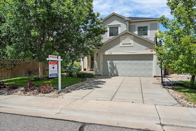 22379 E Dorado Ave, Aurora, CO 80015 - view of front facade featuring driveway and a garage