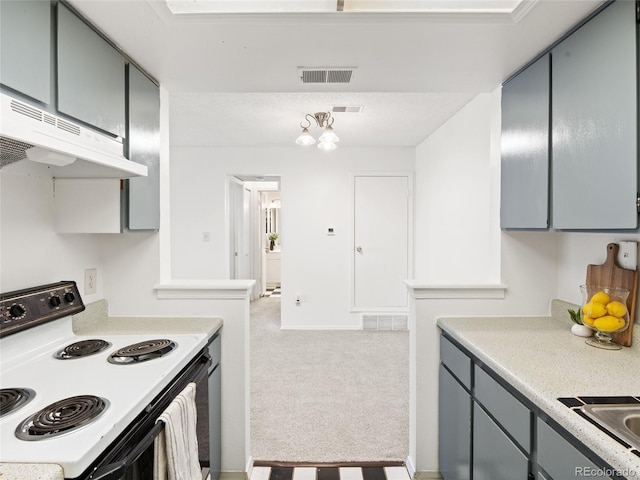 kitchen with range with electric cooktop, gray cabinets, under cabinet range hood, light colored carpet, and light countertops