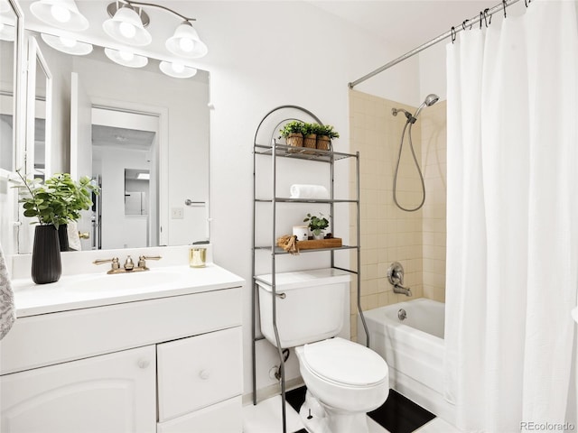 full bathroom featuring shower / bath combo, toilet, and vanity