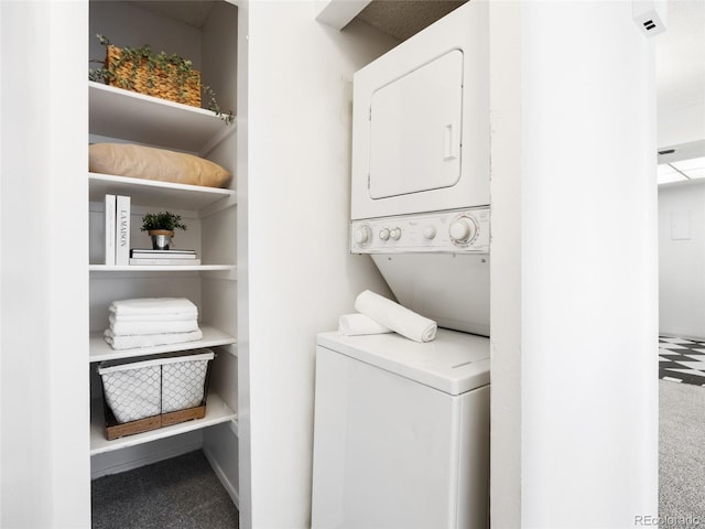 washroom with stacked washer / drying machine and carpet floors