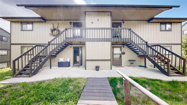 144 Tall Pine Cir, Grand Lake, CO 80447 - rear view of property featuring stairway and a patio