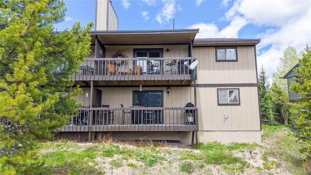 144 Tall Pine Cir, Grand Lake, CO 80447 - rear view of house featuring a balcony
