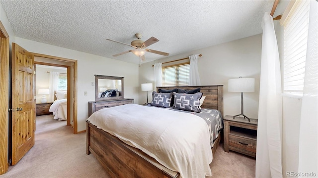 144 Tall Pine Cir, Grand Lake, CO 80447 - bedroom featuring light colored carpet, a textured ceiling, and a ceiling fan
