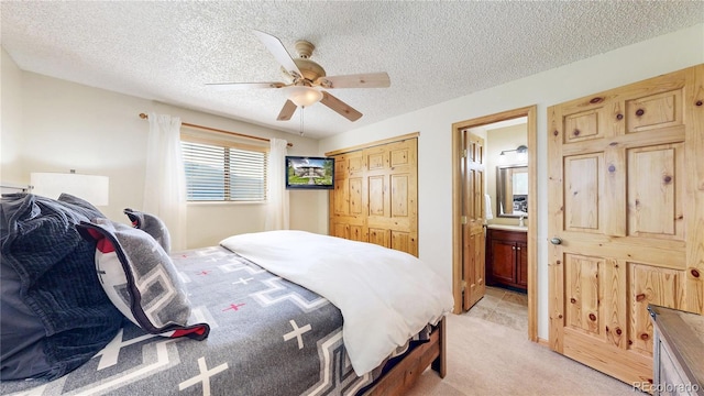 144 Tall Pine Cir, Grand Lake, CO 80447 - bedroom with light carpet, a textured ceiling, connected bathroom, a ceiling fan, and a closet