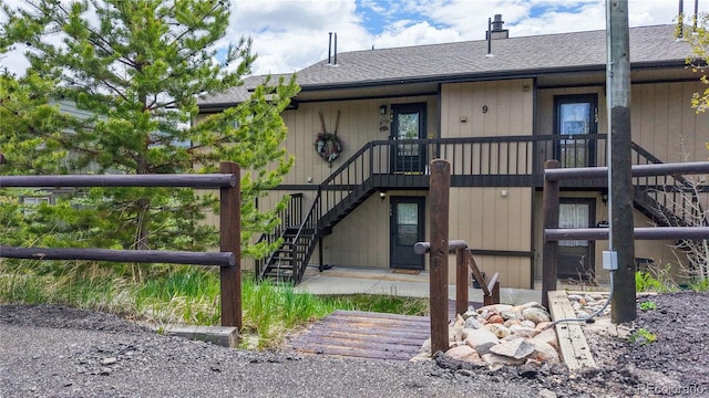 144 Tall Pine Cir, Grand Lake, CO 80447 - property entrance with a shingled roof