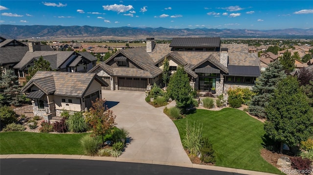 birds eye view of property with a mountain view