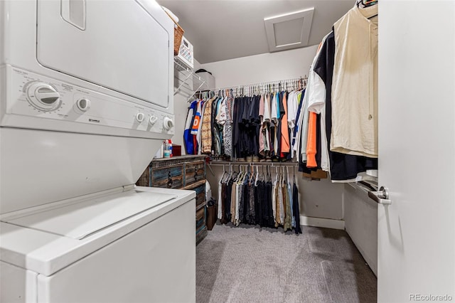 washroom with light colored carpet and stacked washer / dryer