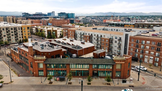 property's view of city featuring a mountain view