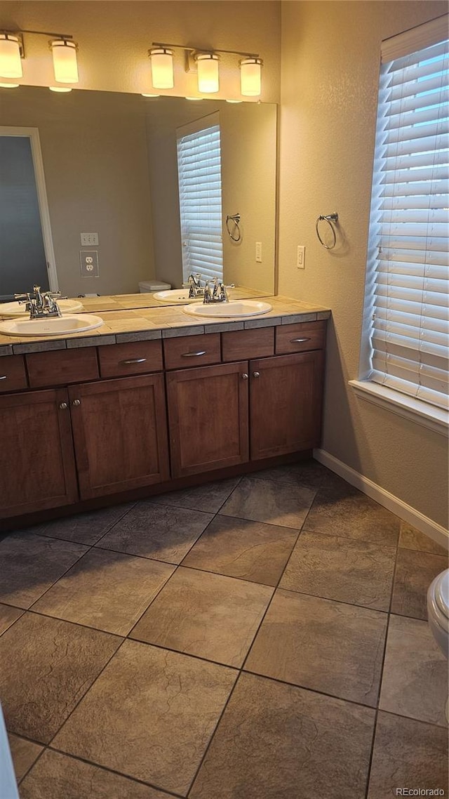 bathroom with vanity and tile patterned floors