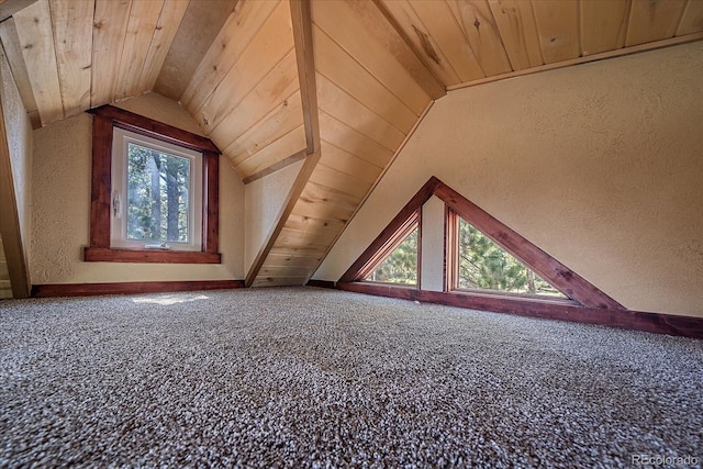 bonus room featuring wooden ceiling, carpet floors, and vaulted ceiling