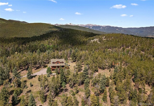 property view of mountains with a forest view