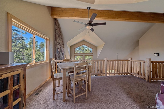 dining space featuring carpet floors, a wealth of natural light, vaulted ceiling with beams, and a ceiling fan