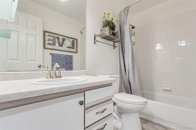 full bathroom featuring hardwood / wood-style flooring, vanity, toilet, and shower / bath combo