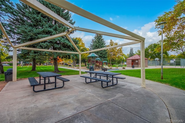 surrounding community featuring a playground and a yard