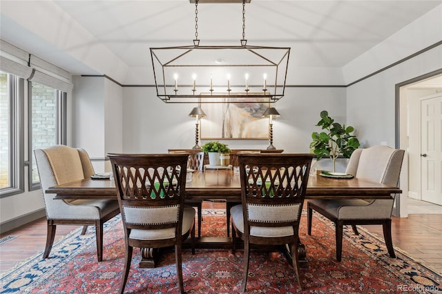 dining space featuring a chandelier and wood-type flooring