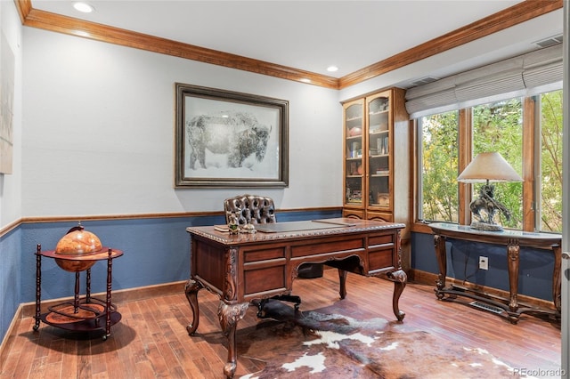 office featuring hardwood / wood-style floors and ornamental molding