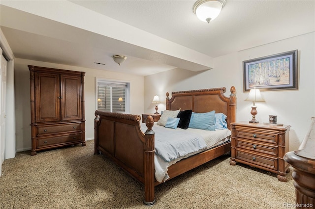 bedroom with dark carpet