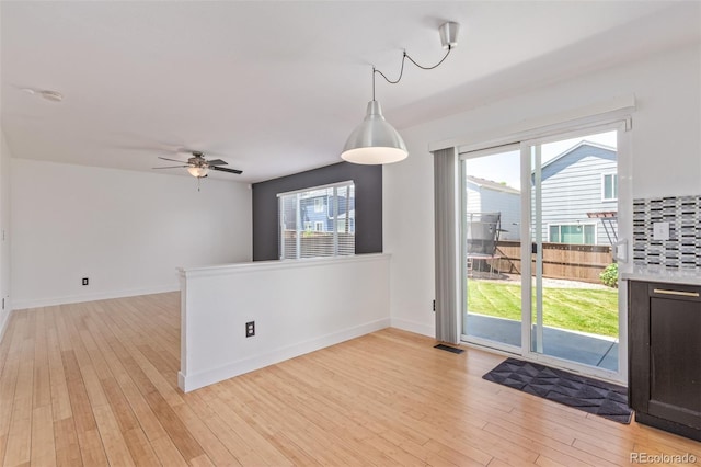 4935 Apollo Bay Dr, Highlands Ranch, CO 80130 - spare room with light wood-type flooring, plenty of natural light, and a ceiling fan