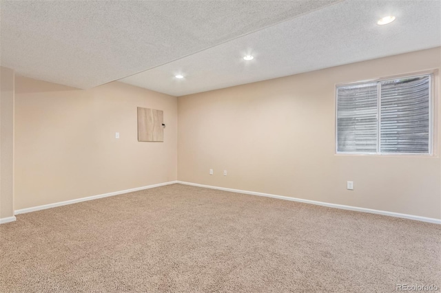 4935 Apollo Bay Dr, Highlands Ranch, CO 80130 - spare room featuring carpet, recessed lighting, baseboards, and a textured ceiling