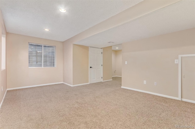 4935 Apollo Bay Dr, Highlands Ranch, CO 80130 - unfurnished room featuring carpet floors, baseboards, recessed lighting, and a textured ceiling