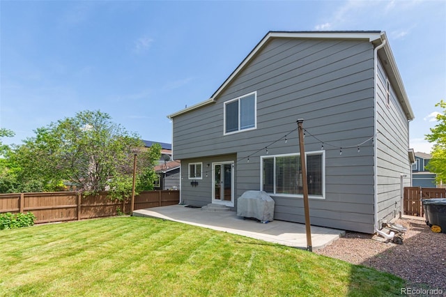 4935 Apollo Bay Dr, Highlands Ranch, CO 80130 - rear view of house with a patio area