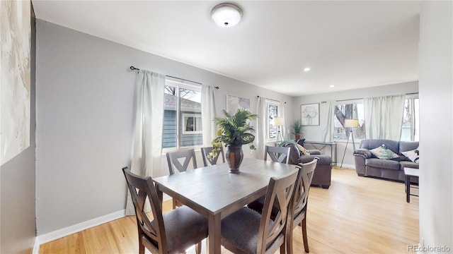 dining area with light wood-type flooring