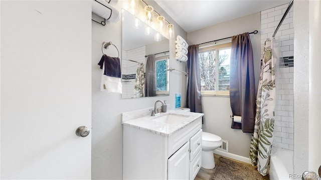 full bathroom with vanity, toilet, and shower / bath combo with shower curtain