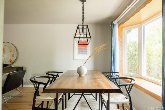 654 S Shoshone St, Denver, CO 80223 - dining room with light wood-style floors and baseboards