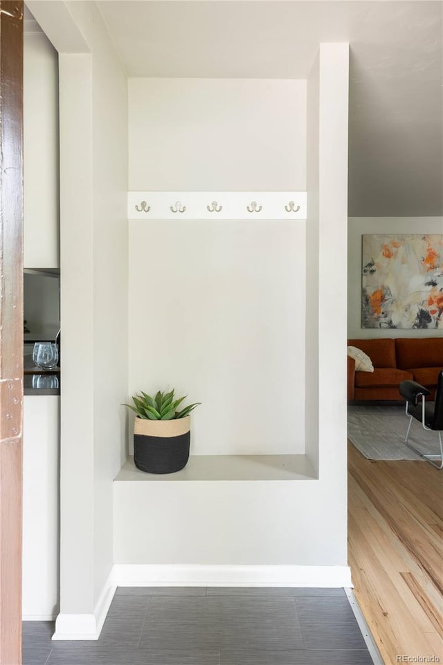 654 S Shoshone St, Denver, CO 80223 - detailed view of baseboards and wood finished floors