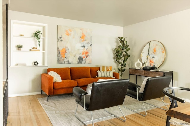 654 S Shoshone St, Denver, CO 80223 - sitting room with wood finished floors and baseboards