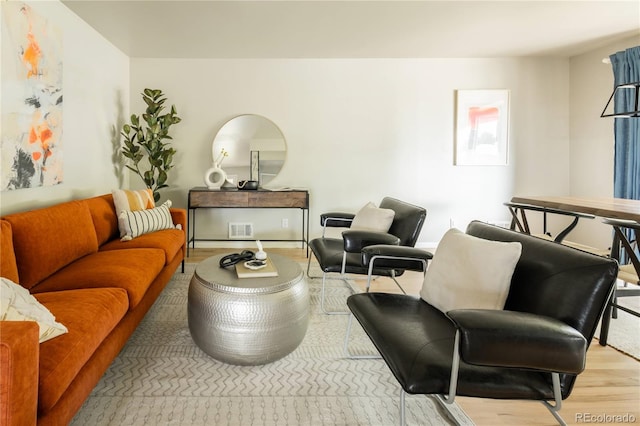 654 S Shoshone St, Denver, CO 80223 - living area featuring wood finished floors