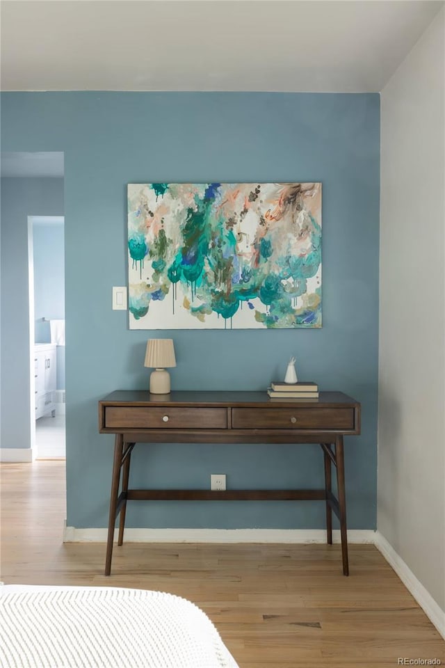 654 S Shoshone St, Denver, CO 80223 - bedroom featuring light wood finished floors and baseboards