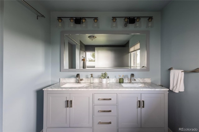654 S Shoshone St, Denver, CO 80223 - full bathroom with double vanity and healthy amount of natural light