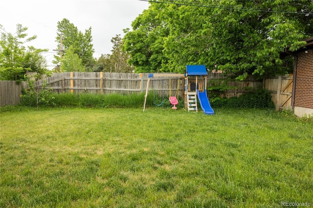 654 S Shoshone St, Denver, CO 80223 - view of yard with a playground