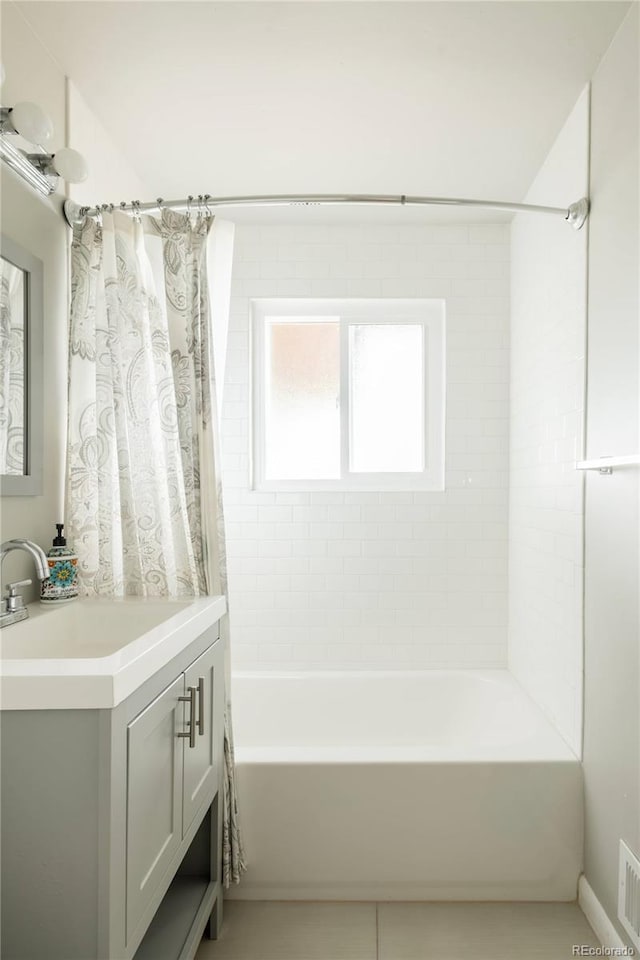 654 S Shoshone St, Denver, CO 80223 - bathroom featuring vanity and shower / bathtub combination with curtain