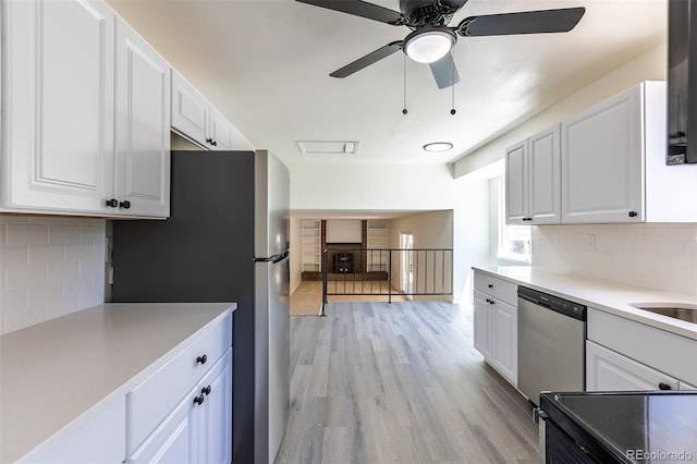 3256 S Nucla St, Aurora, CO 80013 - kitchen featuring stainless steel appliances, white cabinetry, and a ceiling fan