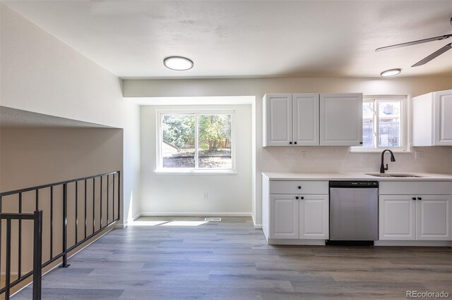 3256 S Nucla St, Aurora, CO 80013 - kitchen featuring a sink, stainless steel dishwasher, plenty of natural light, and light wood finished floors