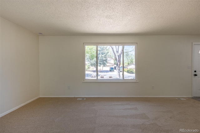 3256 S Nucla St, Aurora, CO 80013 - carpeted empty room featuring a textured ceiling and baseboards
