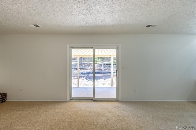 3256 S Nucla St, Aurora, CO 80013 - spare room with light colored carpet, a textured ceiling, and baseboards