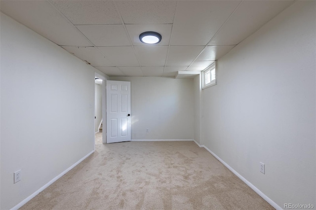 3256 S Nucla St, Aurora, CO 80013 - below grade area featuring carpet, a paneled ceiling, and baseboards