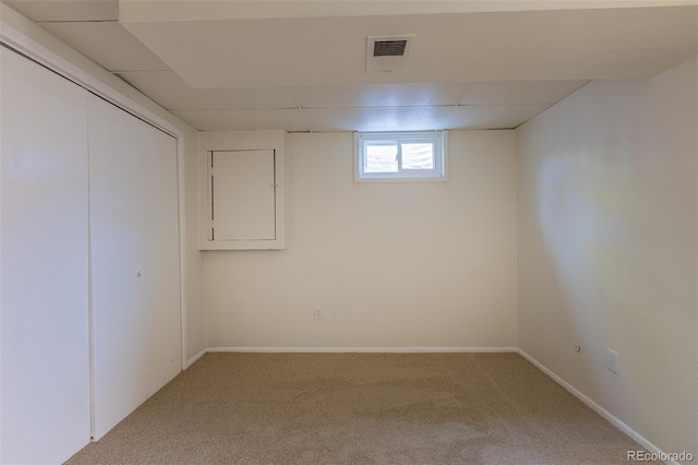 3256 S Nucla St, Aurora, CO 80013 - below grade area featuring carpet flooring, a paneled ceiling, and baseboards