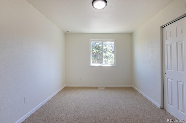3256 S Nucla St, Aurora, CO 80013 - spare room featuring light colored carpet and baseboards