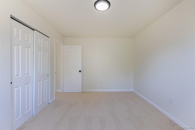 3256 S Nucla St, Aurora, CO 80013 - unfurnished bedroom featuring light carpet, baseboards, and a closet