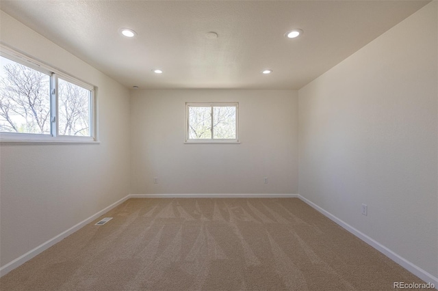 3256 S Nucla St, Aurora, CO 80013 - empty room featuring recessed lighting, light carpet, and baseboards