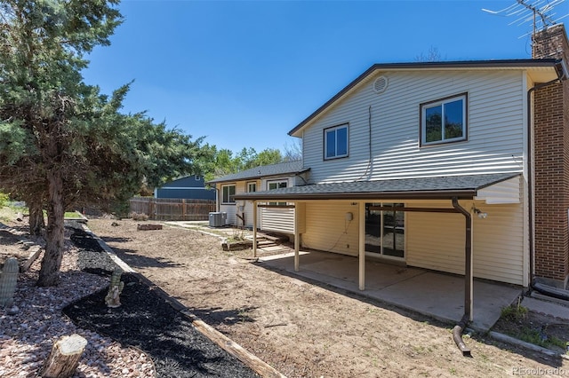 3256 S Nucla St, Aurora, CO 80013 - back of property featuring a patio, central AC, and fence