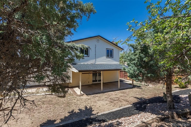 3256 S Nucla St, Aurora, CO 80013 - rear view of house with a patio area and fence