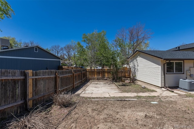 3256 S Nucla St, Aurora, CO 80013 - fenced backyard featuring central air condition unit and a patio
