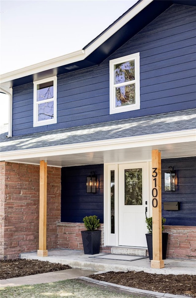 property entrance with covered porch