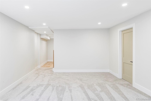 finished below grade area featuring recessed lighting, carpet flooring, and baseboards
