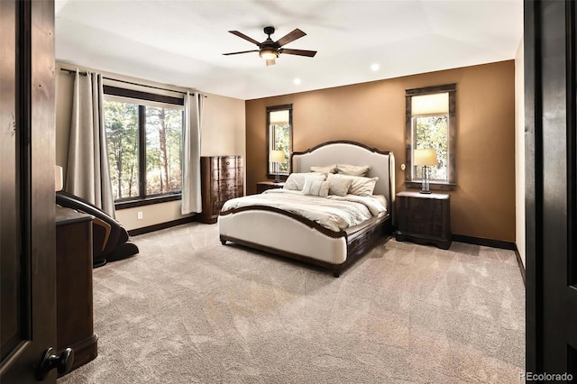 bedroom featuring baseboards, light carpet, and a ceiling fan